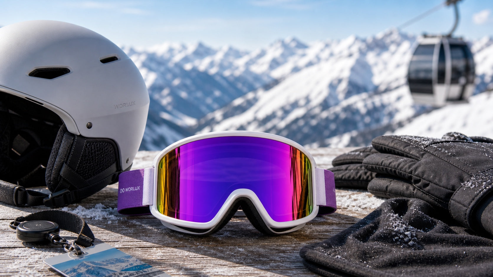 WORLUX Sports ski goggles with snow gear on a mountain table