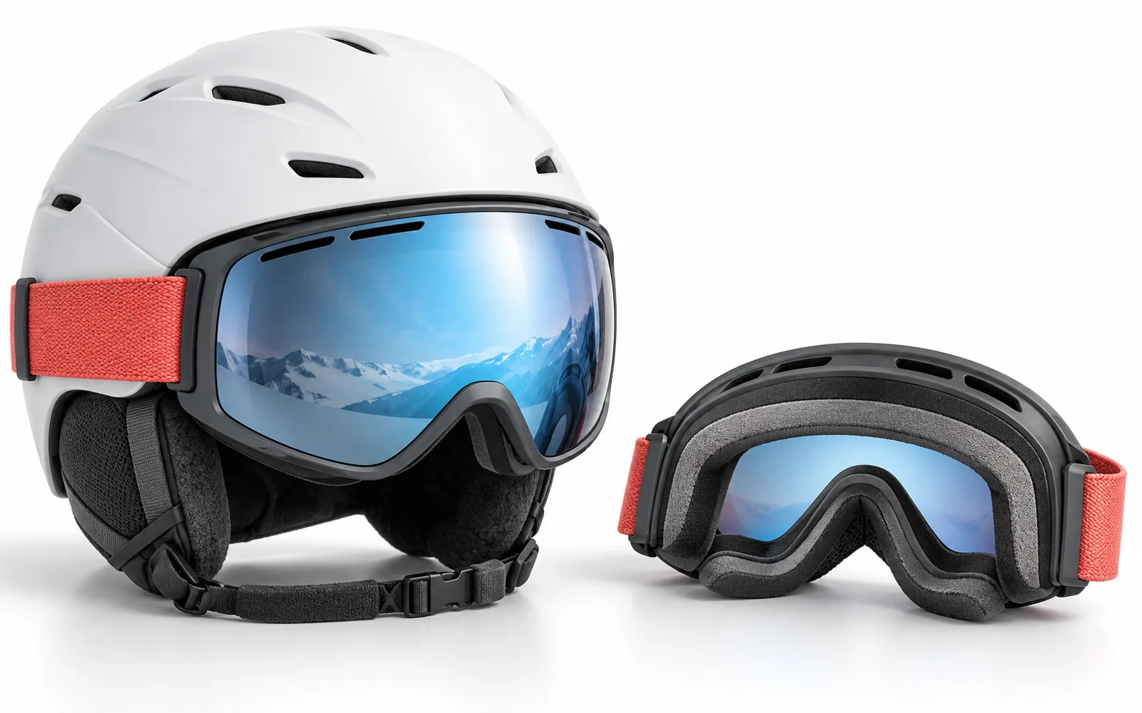 A snow goggle fitted against a helmet and a second goggle showing its facial foam
